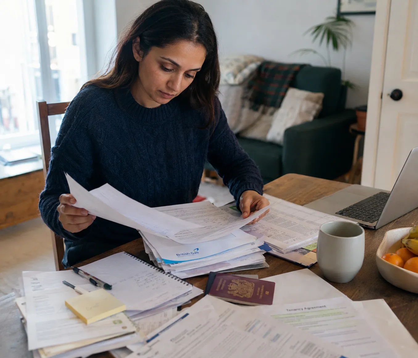 Applicant reviewing passports, travel dates and immigration records for a UK long residence application